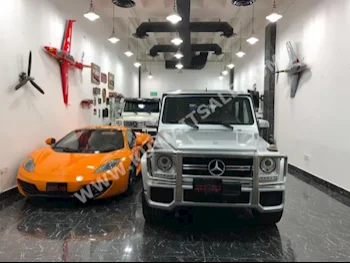 مرسيدس - بنز  55 AMG  جي - كلاس  2014  63,000  اس يو في  اتوماتك  8  جلد  دفع رباعي  فضي  بنزين