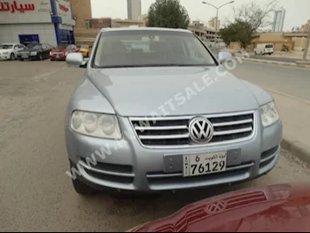 فوكس واغن  طوارق  2004  130,000  اس يو في  اتوماتك  8  جلد  دفع خلفي  سمائي  بنزين
