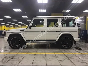 مرسيدس - بنز  63 AMG  جي - كلاس  2013  100,000  اس يو في  اتوماتك  8  جلد  دفع رباعي  أبيض  بنزين