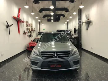 مرسيدس - بنز  63 AMG  ام ال - كلاس  2013  75,000  اس يو في  اتوماتك  6  جلد  دفع رباعي  رمادي  بنزين