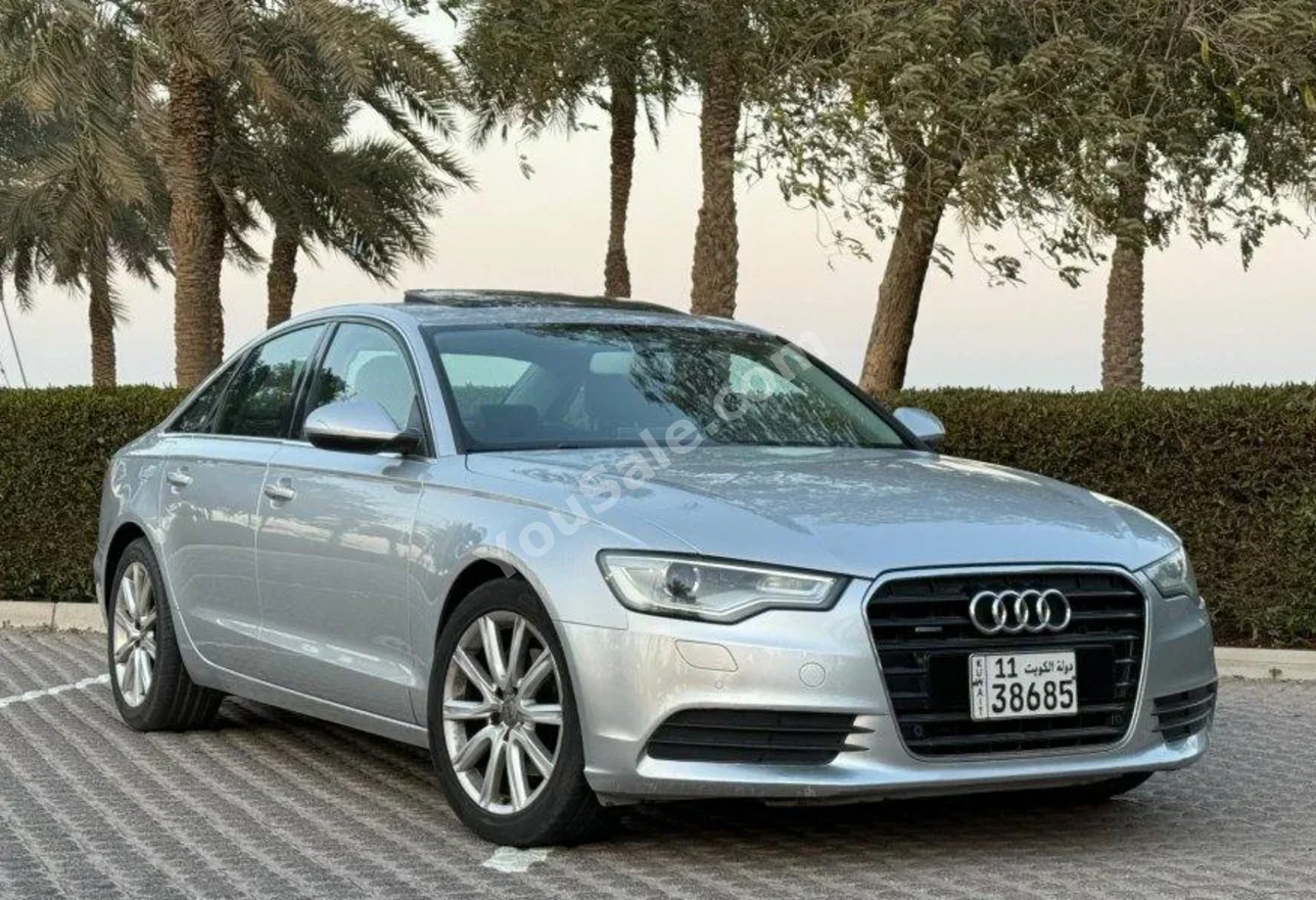 اودي أي 6 TFSI 2015 اتوماتيك 127,000 كم 6 سلندر دفع أمامي سيدان فضي