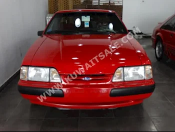 Ford  Mustang  1991  0  Coupe / Sport  Automatic  8  Cloth  RWD  Red  Gasoline