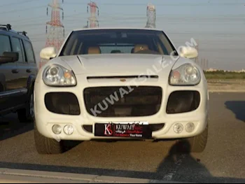 بورش  كيان  2006  144,000  اس يو في  اتوماتك  6  جلد  دفع رباعي  أبيض  بنزين