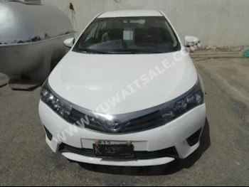 Toyota  XLI  Corolla  2014  59,000  Sedan  Automatic  4  Cloth  FWD  White  Gasoline