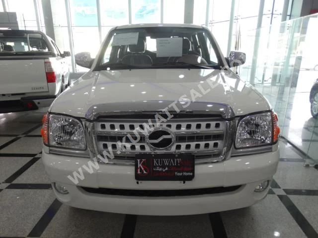 ZX Auto  Grand Tiger  2015  0  Pick Up  Manual  4  Cloth  FWD  White  Gasoline