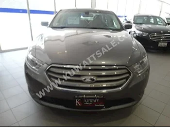 Ford  SEL  Taurus  2014  18,000  Sedan  Automatic  6  Cloth  FWD  Gray  Gasoline