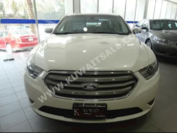 Ford  SE  Taurus  2015  26,000  Sedan  Automatic  6  Cloth  FWD  White  Gasoline