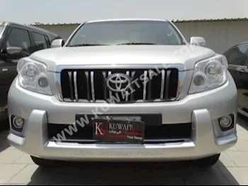 Toyota  TXL  Prado  2013  63,000  SUV  Automatic  6  Cloth  4WD  Silver  Gasoline