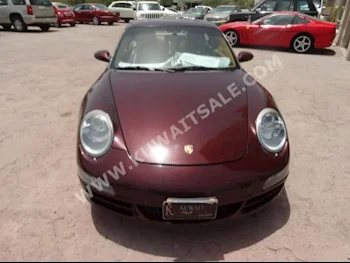 Porsche  Carrera  2007  86,000  Coupe / Sport  Automatic  6  Leather  RWD  Maroon  Gasoline