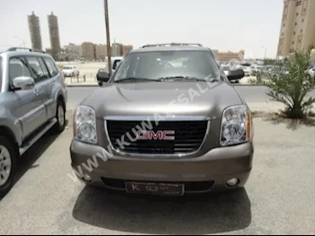 GMC  Yukon  2013  70,000  SUV  Automatic  8  Cloth  RWD  Brown  Gasoline