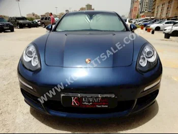 Porsche  Panamera  2014  40,000  Sedan  Automatic  6  Leather  FWD  Turquoise  Gasoline