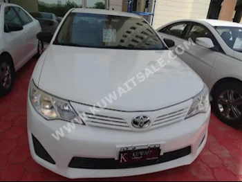 Toyota  GL  Camry  2014  42,500  Sedan  Automatic  4  Cloth  FWD  White  Gasoline