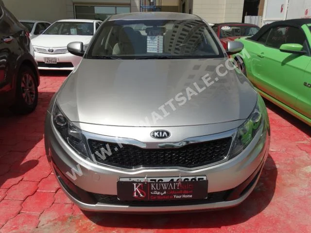 Kia  Optima  2014  43,000  Sedan  Automatic  4  Cloth  FWD  Gold  Gasoline