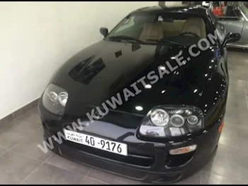 Toyota  Supra  1997  10,000  Coupe / Sport  Manual  6  Cloth  RWD  Black  Gasoline