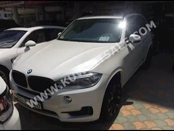 BMW  5  X-Series  2014  65,000  SUV  Automatic  8  Leather  4WD  White  Gasoline