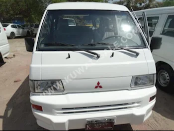 Mitsubishi  L300  2011  123,000  Van / Bus  Manual  4  Cloth  RWD  White  Gasoline