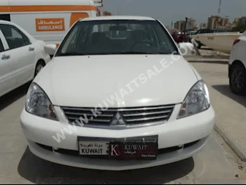Mitsubishi  Lancer  2014  97,000  Sedan  Automatic  4  Cloth  FWD  White  Gasoline