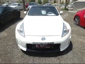 Nissan  370  Z  2014  70,000  Coupe / Sport  Automatic  6  Leather  RWD  White  Gasoline