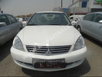 Mitsubishi  Lancer  2014  60,000  Sedan  Automatic  4  Cloth  FWD  White  Gasoline