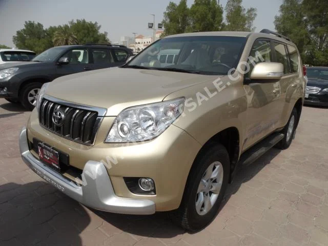 Toyota  TXL  Prado  2013  50,000  SUV  Automatic  6  Cloth  4WD  Gold  Gasoline