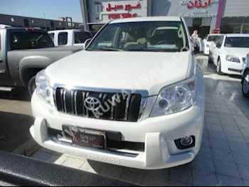 Toyota  TXL  Prado  2012  98,000  SUV  Automatic  6  Cloth  RWD  Off White  Gasoline