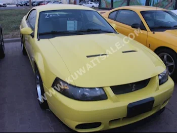 Ford  Cobra  2003  90,000  Coupe / Sport  Manual  8  Leather  RWD  Yellow  Gasoline