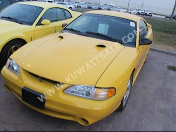 Ford  Cobra  1998  9,000  Coupe / Sport  Manual  8  Leather  RWD  Yellow  Gasoline
