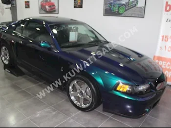 Ford  Cobra  2004  12,000  Coupe / Sport  Manual  8  Leather  RWD  Turquoise  Gasoline