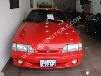 Ford  Cobra  1993  161,000  Coupe / Sport  Manual  8  Leather  RWD  Orange  Gasoline