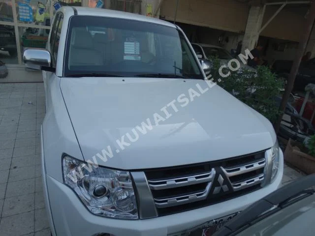Mitsubishi  Pajero  2013  114,000  SUV  Automatic  6  Cloth  RWD  Gray  Gasoline