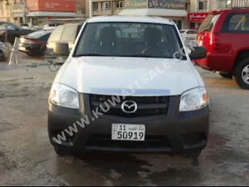 Mazda  BT-50  2013  26,000  Pick Up  Manual  4  Cloth  RWD  White  Gasoline