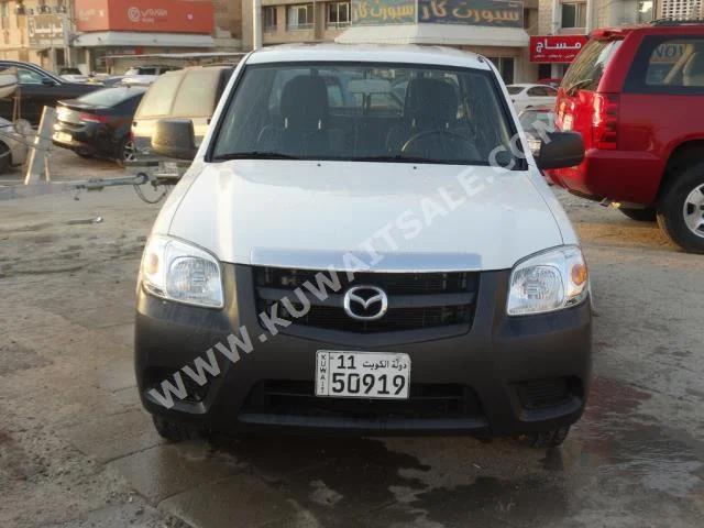 Mazda  BT-50  2013  26,000  Pick Up  Manual  4  Cloth  RWD  White  Gasoline