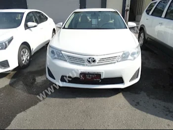 Toyota  GL  Camry  2015  39,000  Sedan  Automatic  4  Cloth  FWD  White  Gasoline
