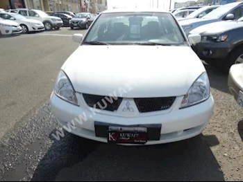 Mitsubishi  GLX  Lancer  2007  150,000  Sedan  Automatic  4  Cloth  FWD  White  Gasoline