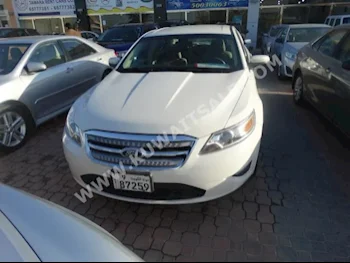 Ford  SEL  Taurus  2012  99,000  Sedan  Automatic  6  Cloth  FWD  White  Gasoline