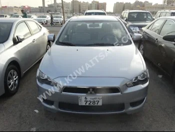 Mitsubishi  Lancer  2015  44,000  Sedan  Automatic  4  Cloth  FWD  Silver  Gasoline