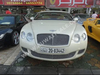 Bentley  GT Speed  2009  59,000  Coupe / Sport  Automatic  12  Leather  RWD  Beige  Gasoline