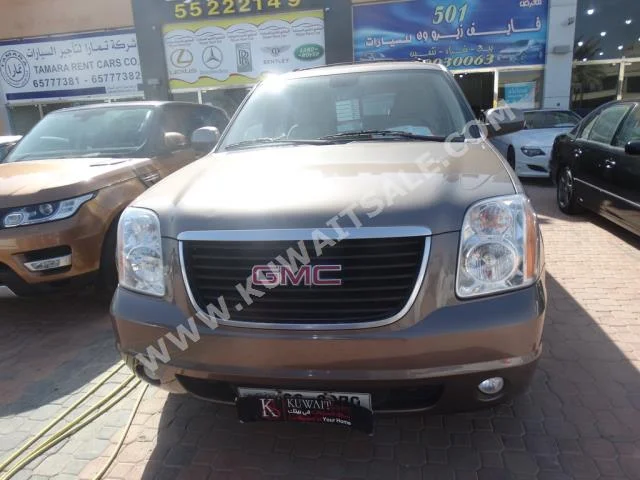 GMC  Yukon  2012  99,000  SUV  Automatic  8  Cloth  4WD  Gray  Gasoline