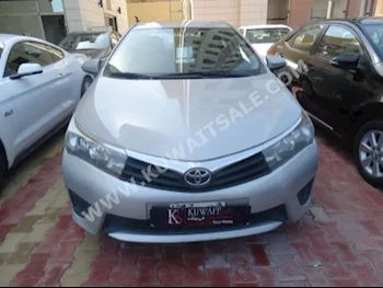 Toyota  XLI  Corolla  2015  82,000  Sedan  Automatic  4  Cloth  FWD  Silver  Gasoline